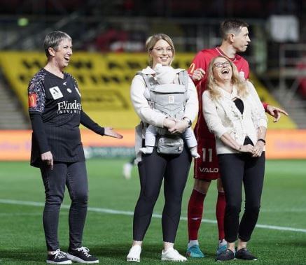 Katelyn Timmings with her son and soon-to-be mother-in-law in the stadium to cheer for her fiance Craig Goodwin.